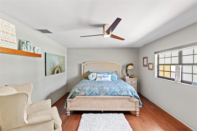 bedroom featuring hardwood / wood-style floors and ceiling fan