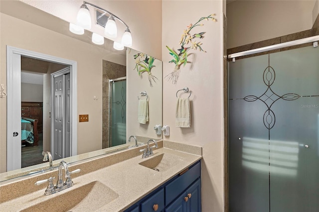 bathroom with vanity and a shower with shower door