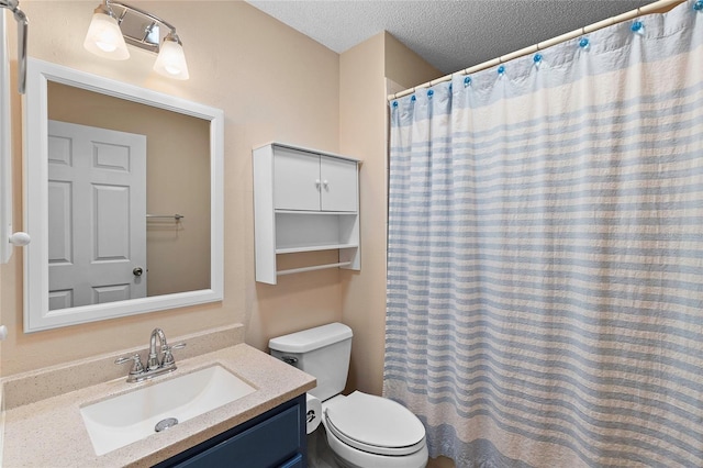 bathroom featuring vanity, walk in shower, a textured ceiling, and toilet