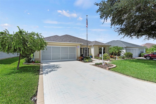 ranch-style home with a garage and a front yard