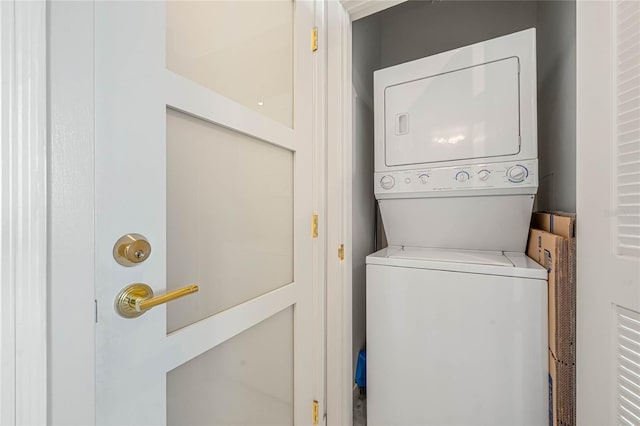 washroom with stacked washer / drying machine