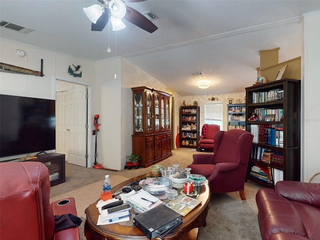 living room with light colored carpet, vaulted ceiling, and ceiling fan