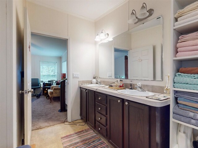 bathroom with tile patterned flooring and dual bowl vanity