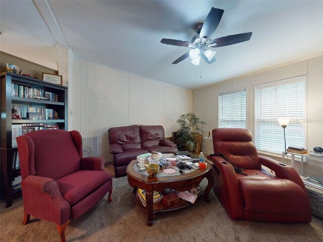 carpeted living room featuring ceiling fan