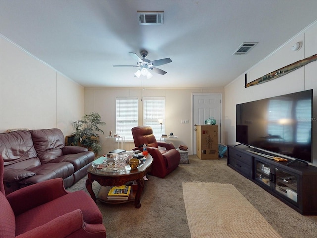 carpeted living room with ceiling fan