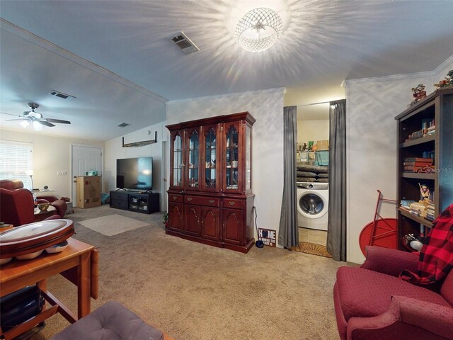 carpeted living room with washer / dryer, lofted ceiling, and ceiling fan