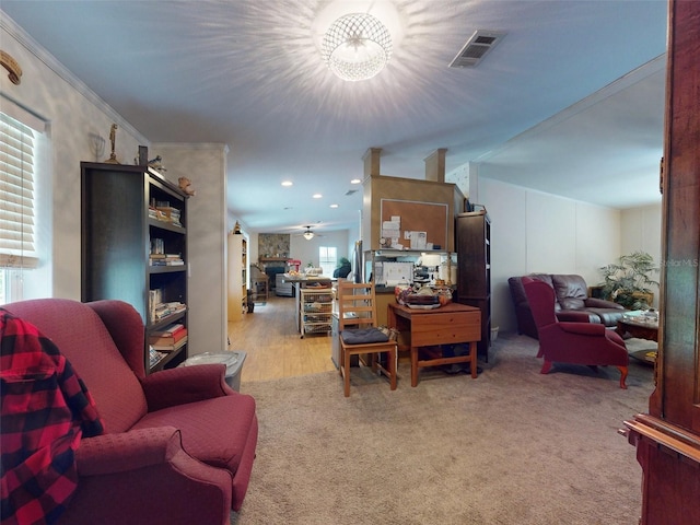 living room featuring light colored carpet and crown molding