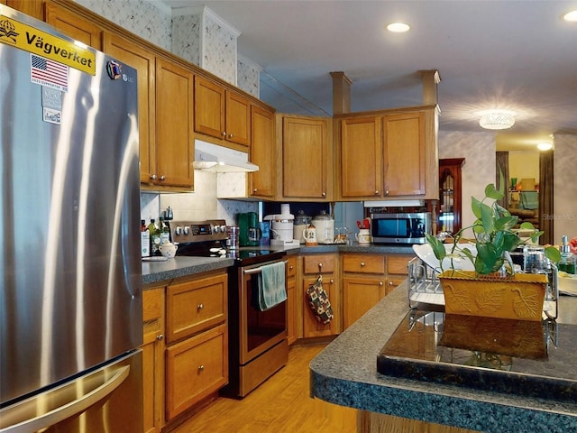 kitchen featuring stainless steel appliances and light wood-type flooring