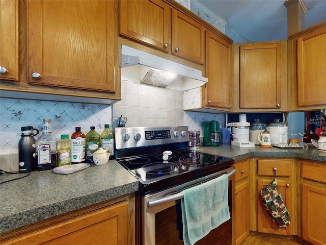 kitchen with decorative backsplash and stainless steel electric range