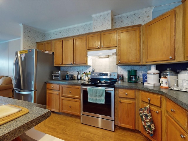 kitchen featuring light hardwood / wood-style flooring, crown molding, backsplash, and stainless steel appliances