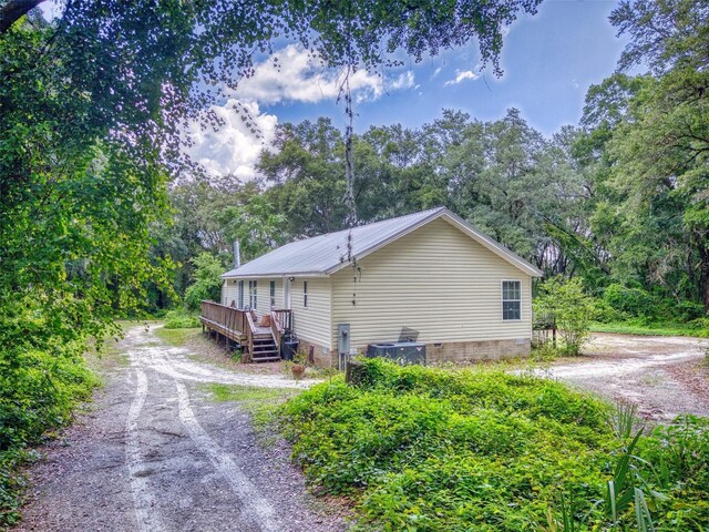 view of side of property with a wooden deck