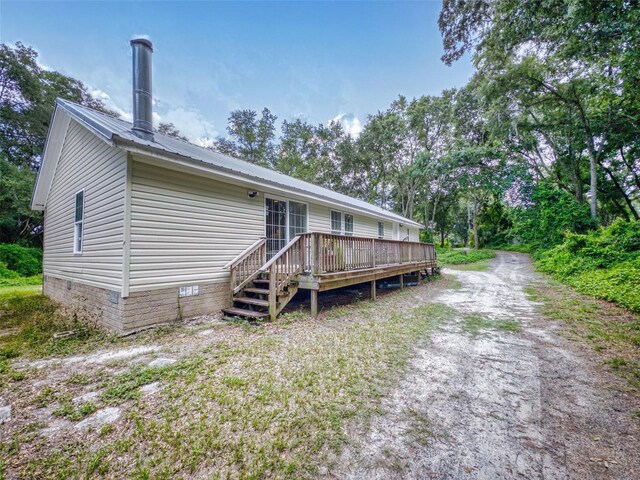 rear view of property with a deck