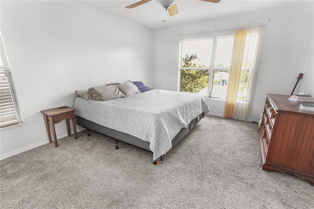 bedroom featuring ceiling fan and light colored carpet