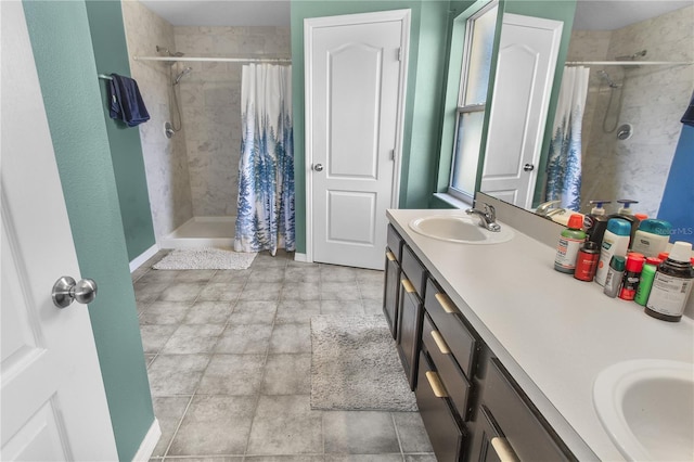 bathroom featuring walk in shower and vanity