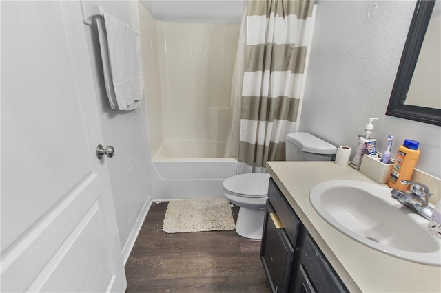 full bathroom with wood-type flooring, vanity, shower / tub combo with curtain, and toilet