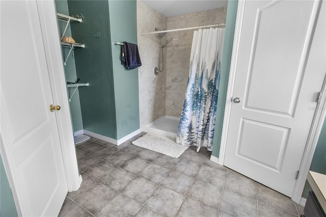 bathroom featuring vanity and a shower with shower curtain