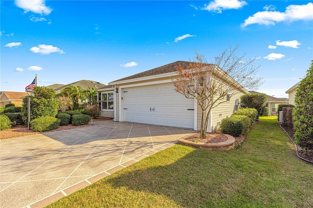 view of side of home featuring a garage and a lawn