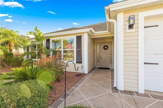 property entrance with a garage