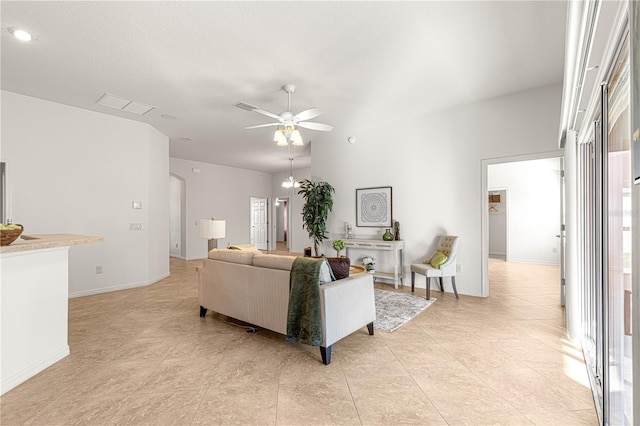 living room featuring ceiling fan and light tile patterned floors