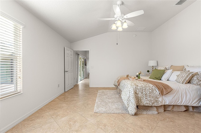 bedroom featuring vaulted ceiling, ceiling fan, and light tile patterned flooring