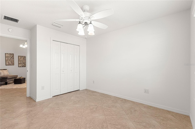 unfurnished bedroom featuring a closet and ceiling fan