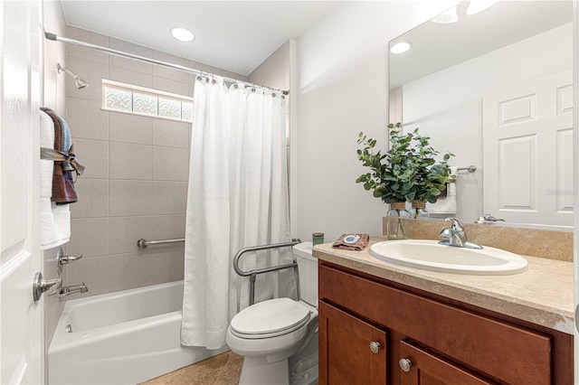 full bathroom featuring tile patterned flooring, vanity, toilet, and shower / tub combo