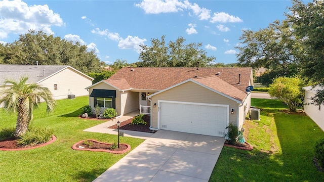 single story home featuring an attached garage, concrete driveway, a front yard, and cooling unit