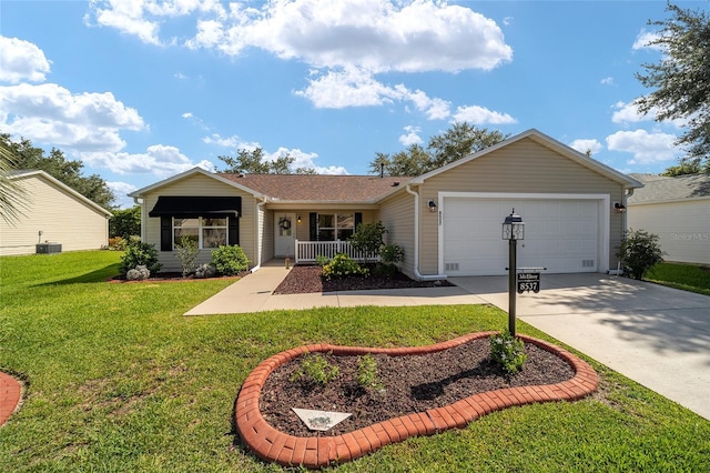 ranch-style home with a garage, driveway, covered porch, a front lawn, and central AC