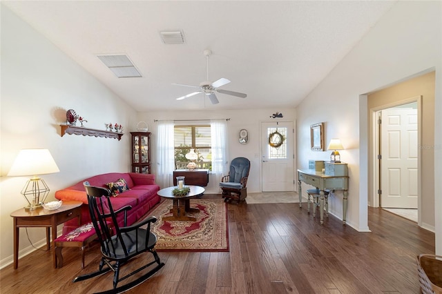 living room with hardwood / wood-style floors, ceiling fan, and lofted ceiling