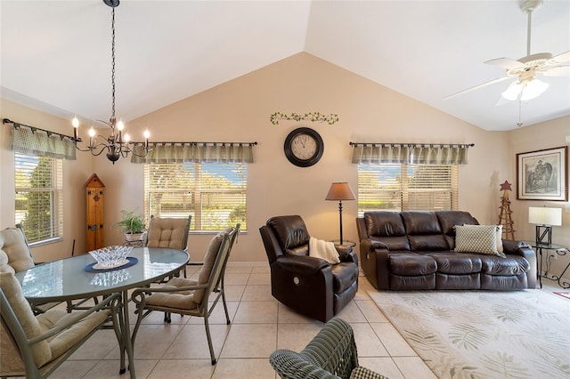 tiled dining room featuring high vaulted ceiling and ceiling fan with notable chandelier