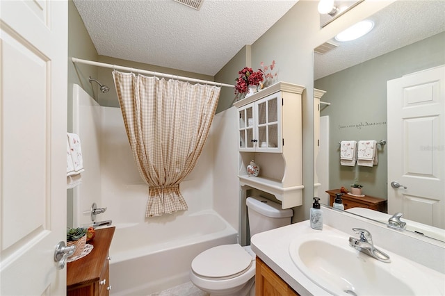 full bathroom featuring a textured ceiling, vanity, shower / tub combo with curtain, and toilet