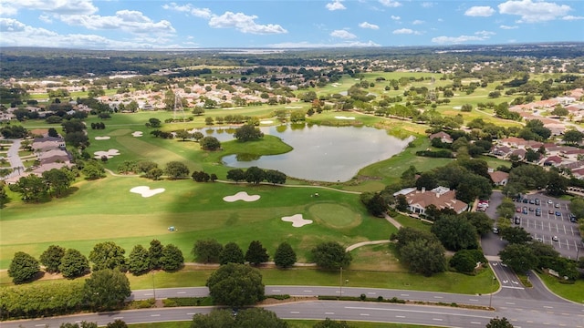 drone / aerial view featuring a water view and golf course view