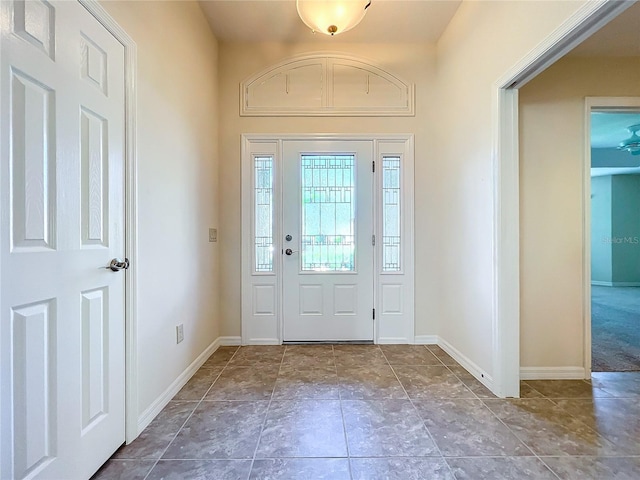 foyer entrance with baseboards