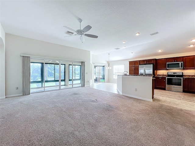 unfurnished living room with lofted ceiling, light colored carpet, ceiling fan, and visible vents