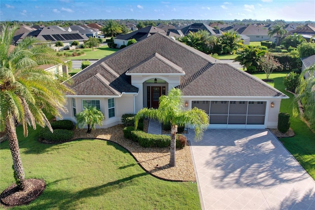 1338 Neuport Path, The Villages, FL 32163 - ranch-style home featuring an attached garage, concrete driveway, a shingled roof, stucco siding, and a residential view