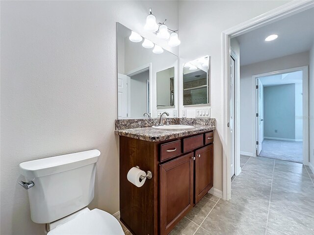1338 Neuport Path, The Villages, FL 32163 - bathroom featuring vanity, toilet, and baseboards