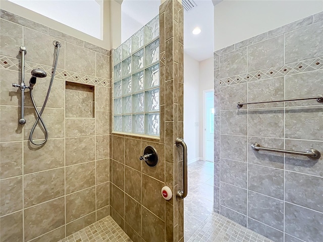 1338 Neuport Path, The Villages, FL 32163 - bathroom featuring a tile shower and tile patterned flooring