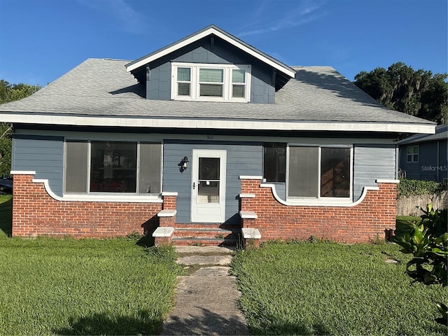 bungalow-style house with a front yard