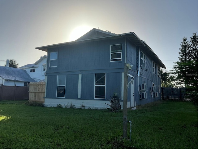 rear view of house with a yard