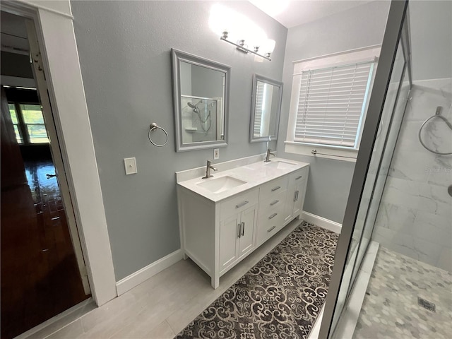 bathroom with vanity, hardwood / wood-style floors, and a shower with shower door