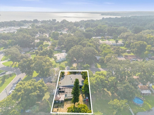 birds eye view of property with a water view