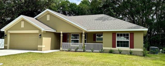 view of front of property with a porch, a garage, a front lawn, and central air condition unit