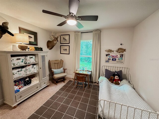 carpeted bedroom with ceiling fan