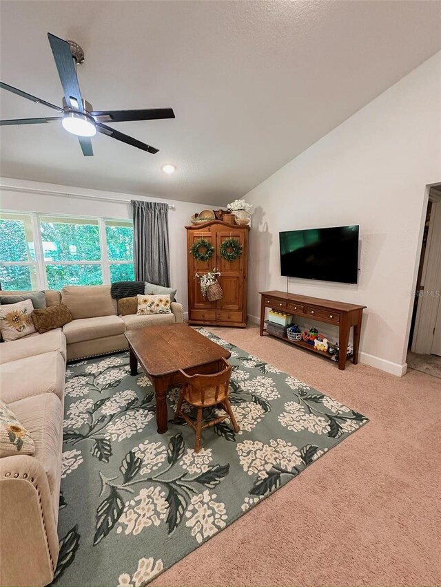 carpeted living room featuring lofted ceiling and ceiling fan