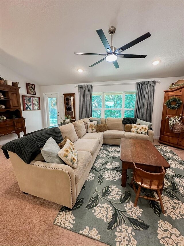 living room with a healthy amount of sunlight, carpet flooring, and ceiling fan