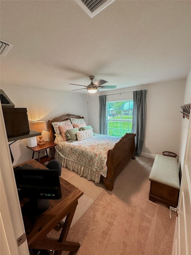 bedroom with ceiling fan and carpet