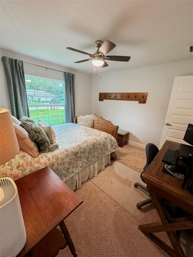 bedroom with carpet flooring, access to outside, a textured ceiling, and ceiling fan