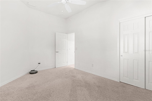 empty room featuring ceiling fan and carpet flooring