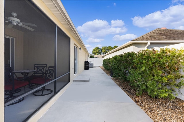 view of patio featuring ceiling fan