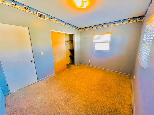 unfurnished bedroom with a closet and carpet